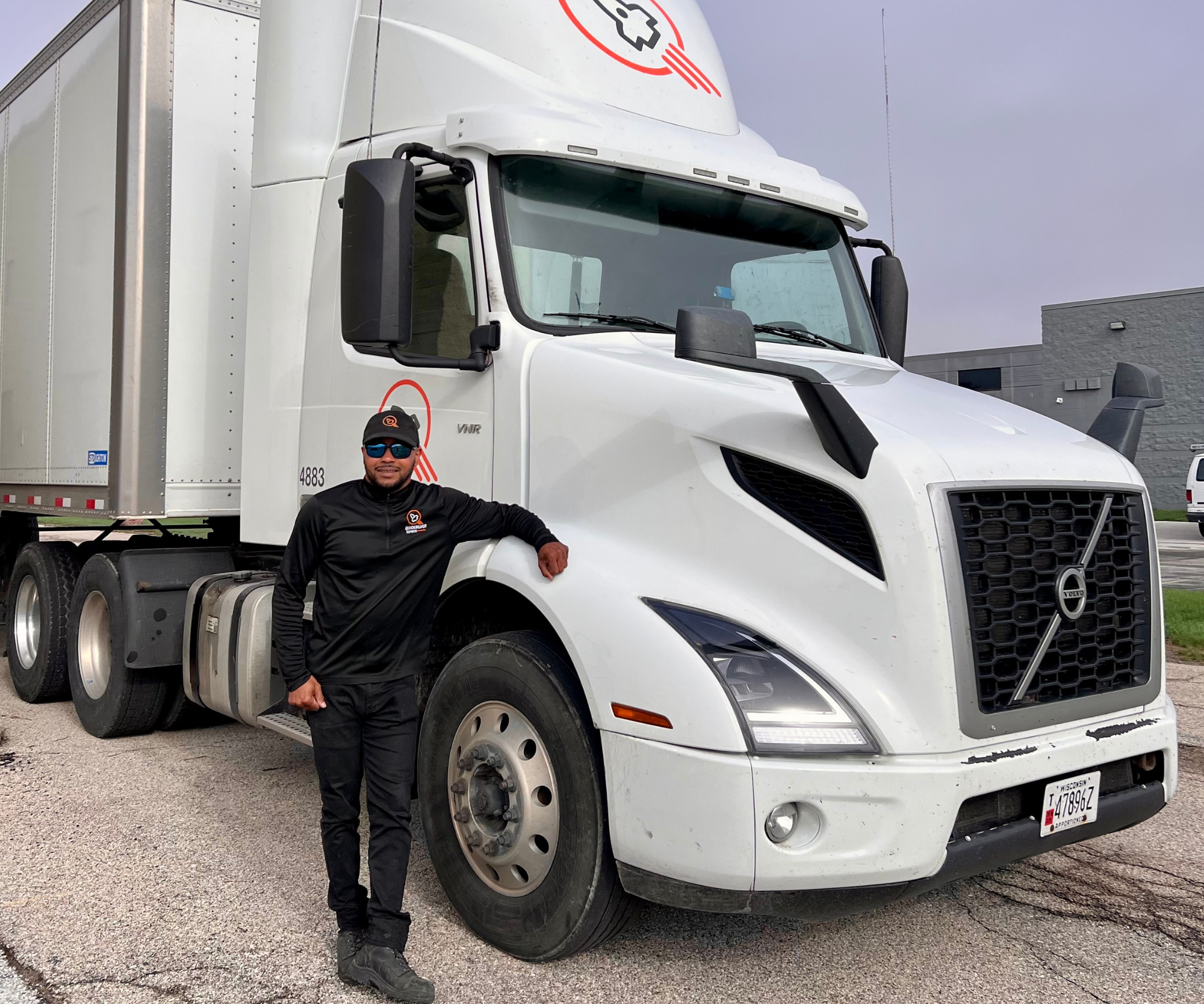 Professional Quicksilver driver in front of a courier vehicle